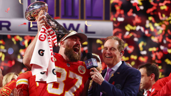 Feb 11, 2024; Paradise, Nevada, USA; Kansas City Chiefs tight end Travis Kelce (87) celebrates with the Vince Lombardi Trophy after defeating the San Francisco 49ers in Super Bowl LVIII at Allegiant Stadium. Mandatory Credit: Mark J. Rebilas-USA TODAY Sports