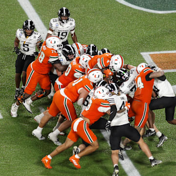 Dec 28, 2024; Orlando, FL, USA; Miami Hurricanes running back Mark Fletcher Jr. (4) scores a touchdown against the Iowa State Cyclones in the third quarter during the Pop Tarts bowl at Camping World Stadium. Mandatory Credit: Nathan Ray Seebeck-Imagn Images