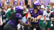 Oct 18, 2025; Fort Worth, Texas, USA; TCU Horned Frogs quarterback Josh Hoover (10) hands off to running back Kevorian Barnes (2) against the Baylor Bears during the second half of a game at Amon G. Carter Stadium. Mandatory Credit: Raymond Carlin III-Imagn Images