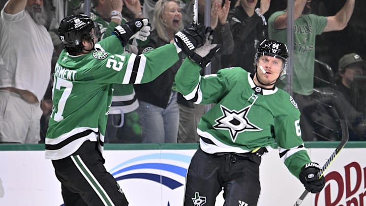 May 13, 2025; Dallas, Texas, USA; Dallas Stars center Mikael Granlund (64) and left wing Mason Marchment (27) and defenseman Thomas Harley (55) and center Tyler Seguin (91) celebrates after Granlund scores a power-play goal against against the Winnipeg Jets during the first period in game four of the second round of the 2025 Stanley Cup Playoffs at American Airlines Center. Mandatory Credit: Jerome Miron-Imagn Images