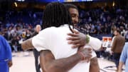 Mar 20, 2023; Memphis, Tennessee, USA; Dallas Mavericks guard Kyrie Irving (2) embraces Memphis Grizzlies guard Ja Morant (12) after the game at FedExForum. Mandatory Credit: Petre Thomas-USA TODAY Sports