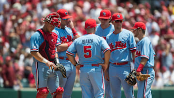 Jun 8, 2019; Fayetteville, AR, USA; Mississippi Rebels head coach Mike Bianco (5) talks with his players while making a pitching change during the game against the Arkansas Razorbacks at Baum-Walker Stadium. Mandatory Credit: Brett Rojo-Imagn Images