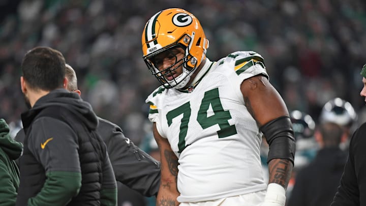 Jan 12, 2025; Philadelphia, Pennsylvania, USA; Green Bay Packers guard Elgton Jenkins (74) walks off the field with an injury against the Philadelphia Eagles in an NFC wild card game at Lincoln Financial Field. Mandatory Credit: Eric Hartline-Imagn Images