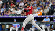 Jun 20, 2025; Denver, Colorado, USA; Arizona Diamondbacks third baseman Eugenio Suarez (28) hits a two run home run in the sixth inning against the Colorado Rockies at Coors Field. Mandatory Credit: Ron Chenoy-Imagn Images