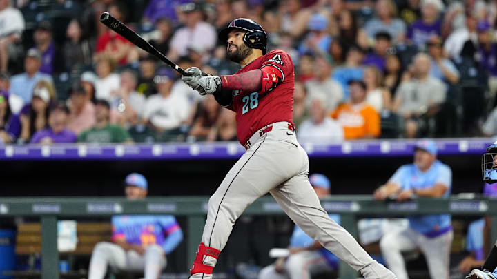 Jun 20, 2025; Denver, Colorado, USA; Arizona Diamondbacks third baseman Eugenio Suarez (28) hits a two run home run in the sixth inning against the Colorado Rockies at Coors Field. Mandatory Credit: Ron Chenoy-Imagn Images Jun 20, 2025; Denver, Colorado, USA; Arizona Diamondbacks third baseman Eugenio Suarez (28) hits a two run home run in the sixth inning against the Colorado Rockies at Coors Field. Mandatory Credit: Ron Chenoy-Imagn Images