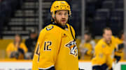 Jan 14, 2025; Nashville, Tennessee, USA;   Nashville Predators center Vinnie Hinostroza (12) warms up before a game against the Vegas Golden Knights at Bridgestone Arena. Mandatory Credit: Steve Roberts-Imagn Images