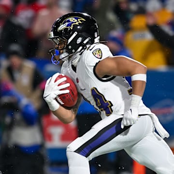 Jan 19, 2025; Orchard Park, New York, USA; Baltimore Ravens running back Keaton Mitchell (34) returns a kickoff against the Buffalo Bills in the fourth quarter of a 2025 AFC divisional round game against the Buffalo Bills at Highmark Stadium. Mandatory Credit: Mark Konezny-Imagn Images