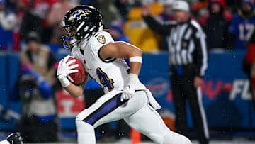 Jan 19, 2025; Orchard Park, New York, USA; Baltimore Ravens running back Keaton Mitchell (34) returns a kickoff against the Buffalo Bills in the fourth quarter of a 2025 AFC divisional round game against the Buffalo Bills at Highmark Stadium. Mandatory Credit: Mark Konezny-Imagn Images