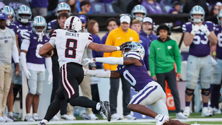 Nov 1, 2025; Manhattan, Kansas, USA; Texas Tech Red Raiders running back Cameron Dickey (8) runs with the ball against Kansas State Wildcats cornerback Amarion Fortenberry (0) during the fourth quarter at Bill Snyder Family Football Stadium. Mandatory Credit: Scott Sewell-Imagn Images