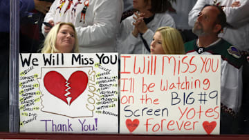 Apr 17, 2024; Tempe, Arizona, USA;  Arizona Coyotes fans in the crowd hold signs for the players following the game against the Edmonton Oilers at Mullett Arena.