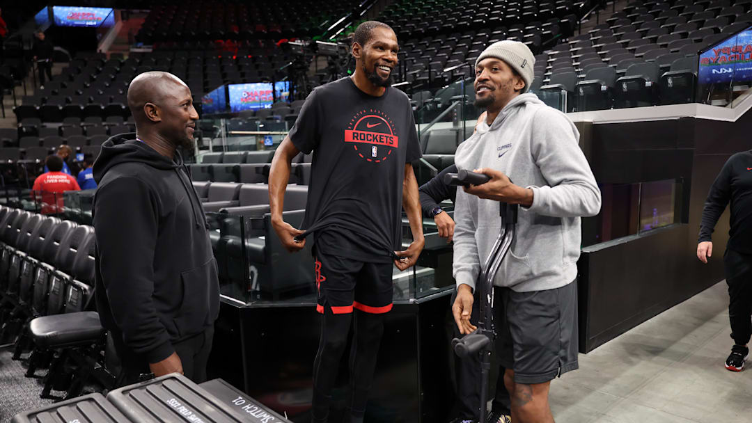 Dec 23, 2025; Inglewood, California, USA;  Houston Rockets forward Kevin Durant (middle) chats with Los Angeles Clippers guard Bradley Beal (right) before the game at Intuit Dome. Mandatory Credit: Kiyoshi Mio-Imagn Images