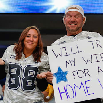 Dallas Cowboys fans hold a sign prior to the game against the New York Giants.