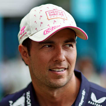 May 5, 2024; Miami Gardens, Florida, USA; Red Bull Racing driver Sergio Perez (11) walks in the paddock before the F1 Miami Grand Prix at Miami International Autodrome. Mandatory Credit: Peter Casey-USA TODAY Sports