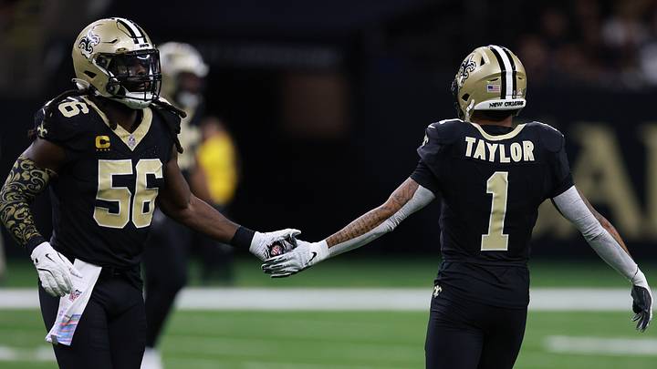 New Orleans Saints LB Demario Davis (56) and CB Alontae Taylor (1) after a stop against the New England Patriots on Oct. 12, 2025.