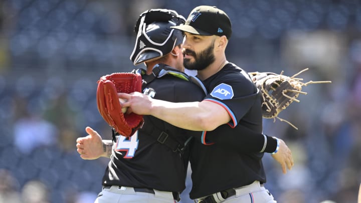 May 29, 2024; San Diego, California, USA;  Miami Marlins pitcher Tanner Scott (66) and Nick Fortes (4) celebrate after the Miami Marlins beat the San Diego Padres 9-1 at Petco Park. Mandatory Credit: Denis Poroy-USA TODAY Sports