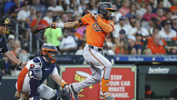 Jun 22, 2024; Houston, Texas, USA; Baltimore Orioles center fielder Cedric Mullins (31) hits an infield single during the fourth inning against the Houston Astros at Minute Maid Park. 