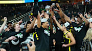 Mar 16, 2024; Las Vegas, NV, USA; Oregon Ducks players celebrate after defeating the Colorado Buffaloes 75-68 to win the Pac-12 Tournament championship at T-Mobile Arena.