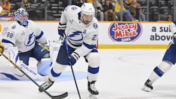 Oct 28, 2025; Nashville, Tennessee, USA;  Tampa Bay Lightning defenseman Ryan McDonagh (27) clears the zone against the Nashville Predators during the third period at Bridgestone Arena. Mandatory Credit: Steve Roberts-Imagn Images