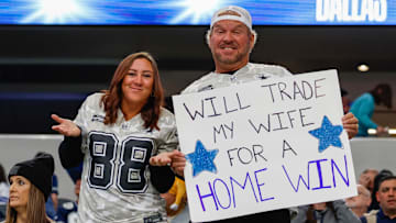 Dallas Cowboys fans hold a sign prior to the game against the New York Giants.