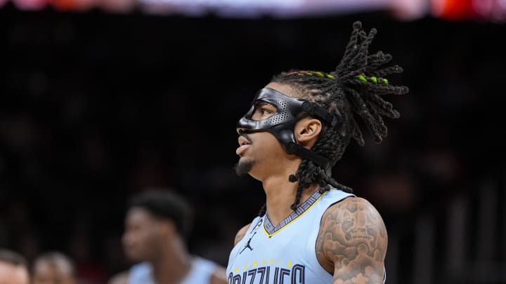 Mar 26, 2023; Atlanta, Georgia, USA; Memphis Grizzlies guard Ja Morant (12) shown with his  face protector before tip off against the Atlanta Hawks at State Farm Arena. 