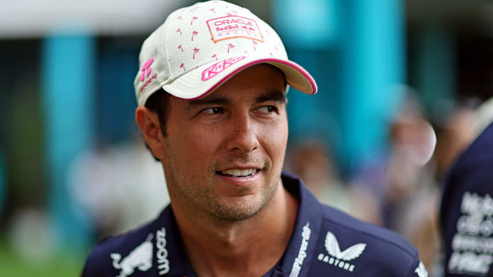 May 5, 2024; Miami Gardens, Florida, USA; Red Bull Racing driver Sergio Perez (11) walks in the paddock before the F1 Miami Grand Prix at Miami International Autodrome. Mandatory Credit: Peter Casey-Imagn Images