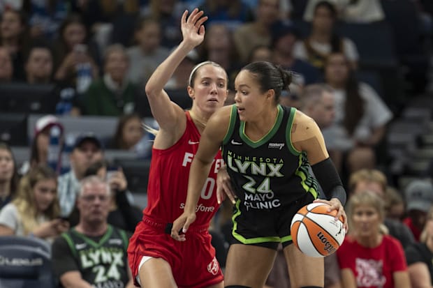 Minnesota Lynx forward Napheesa Collier  drives to the basket past Indiana Fever guard Lexie Hull.