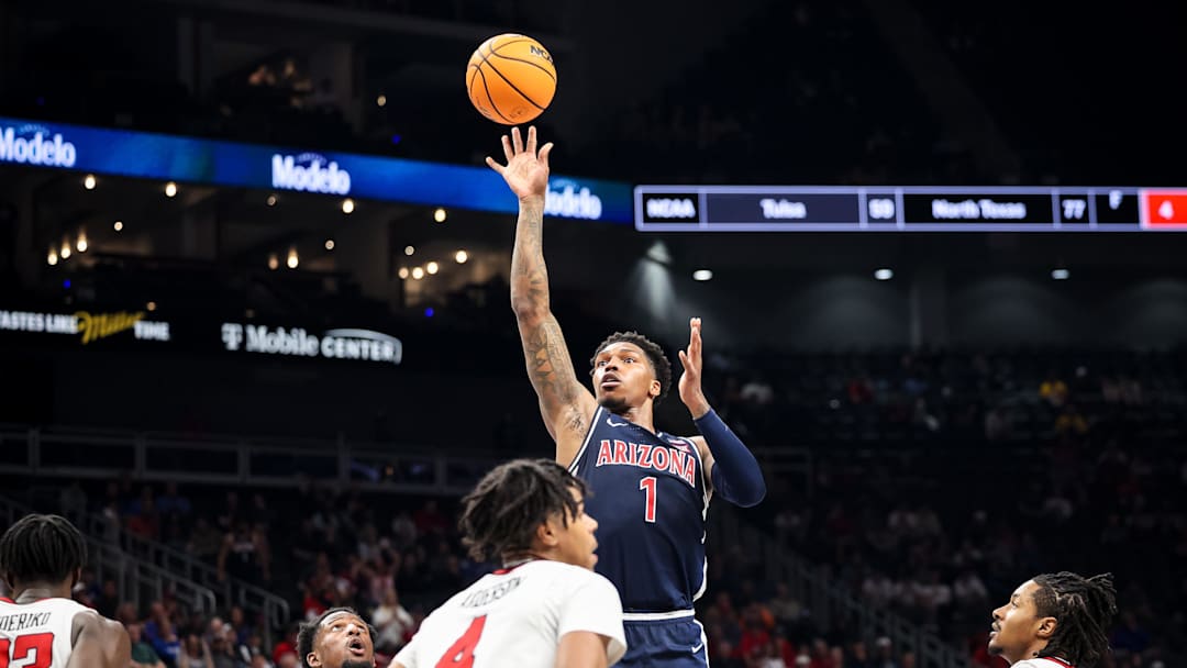 Mar 14, 2025; Kansas City, MO, USA; Arizona Wildcats guard Caleb Love (1) shoots the ball during the second half against the Texas Tech Red Raiders at T-Mobile Center. Mandatory Credit: William Purnell-Imagn Images