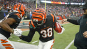 Dec 10, 2023; Cincinnati, Ohio, USA;  Cincinnati Bengals cornerback DJ Ivey (38) celebrates his fumble recovery with cornerback Chidobe Awuzie (22) during the second half against the Indianapolis Colts at Paycor Stadium. Mandatory Credit: Joseph Maiorana-USA TODAY Sports