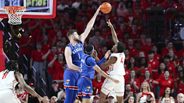 Mar 3, 2025; Houston, Texas, USA; Kansas Jayhawks center Hunter Dickinson (1) blocks a shot by Houston Cougars guard L.J. Cryer (4) during the first half at Fertitta Center. Mandatory Credit: Troy Taormina-Imagn Images