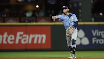 Aug 27, 2024; Seattle, Washington, USA; Tampa Bay Rays second baseman Jose Caballero (7) throws to first base for an out against the Seattle Mariners during the fifth inning at T-Mobile Park. Mandatory Credit: Joe Nicholson-Imagn Images