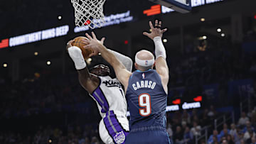 Nov 19, 2025; Oklahoma City, Oklahoma, USA; Sacramento Kings guard Dennis Schroder (17) shoots as Oklahoma City Thunder guard Alex Caruso (9) defends during the second quarter at Paycom Center.