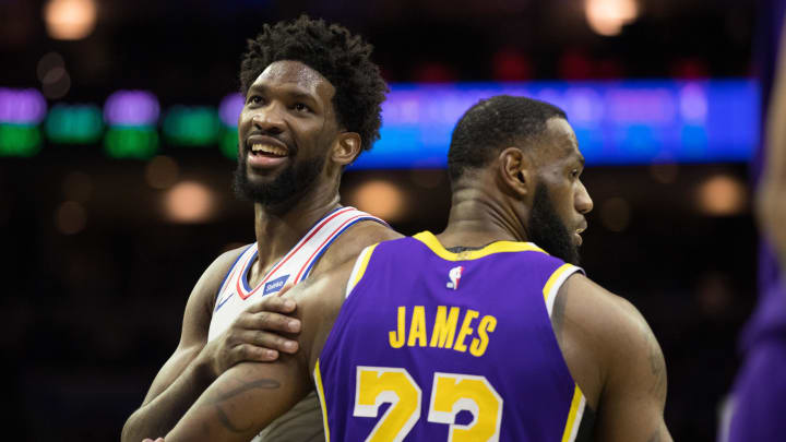 Feb 10, 2019; Philadelphia, PA, USA; Philadelphia 76ers center Joel Embiid (21) reacts with Los Angeles Lakers forward LeBron James (23) after a 76ers score during the fourth quarter at Wells Fargo Center. 