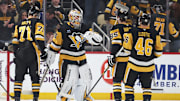 Mar 13, 2025; Pittsburgh, Pennsylvania, USA; Pittsburgh Penguins center Evgeni Malkin (71) and goaltender Tristan Jarry (35) and defenseman Erik Karlsson (65) and center Blake Lizotte (46) celebrate after defeating the St. Louis Blues at PPG Paints Arena. Mandatory Credit: Charles LeClaire-Imagn Images