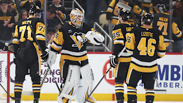 Mar 13, 2025; Pittsburgh, Pennsylvania, USA; Pittsburgh Penguins center Evgeni Malkin (71) and goaltender Tristan Jarry (35) and defenseman Erik Karlsson (65) and center Blake Lizotte (46) celebrate after defeating the St. Louis Blues at PPG Paints Arena. Mandatory Credit: Charles LeClaire-Imagn Images