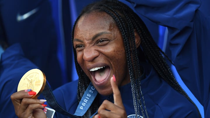Crystal Dunn shows off gold medal after Olympic final v Brazil