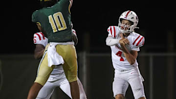 Millard South Jett Thomalla (4) passes against pressure from Basha defensive end Darian (Bleu) Dantzler (10) during a game at Basha High School in Chandler on Aug. 30, 2024.