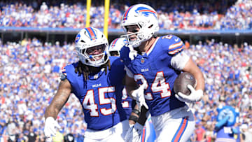 Sep 28, 2025; Orchard Park, New York, USA;  Buffalo Bills safety Cole Bishop (24) and outside linebacker Shaq Thompson (45) celebrate after intercepting a pass intended for New Orleans Saints quarterback Spencer Rattler (2)