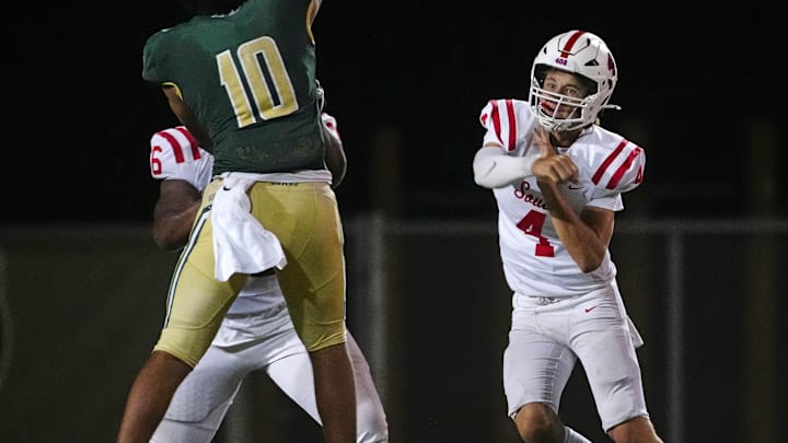 Millard South Jett Thomalla (4) passes against pressure from Basha defensive end Darian (Bleu) Dantzler (10) during a game at Basha High School in Chandler on Aug. 30, 2024.