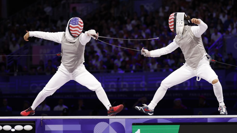 Lee Kiefer (USA) and Lauren Scruggs (USA) compete in the women's foil gold medal bout during the Paris 2024 Olympic Games.