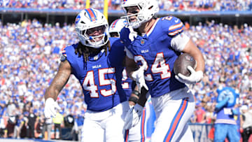 Sep 28, 2025; Orchard Park, New York, USA;  Buffalo Bills safety Cole Bishop (24) and outside linebacker Shaq Thompson (45) celebrate after intercepting a pass intended for New Orleans Saints quarterback Spencer Rattler (2) during the second quarter at Highmark Stadium. 