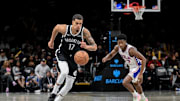 Nov 2, 2025; Brooklyn, New York, USA; Brooklyn Nets forward Michael Porter Jr. (17) leads a fast break as Philadelphia 76ers guard VJ Edgecombe (77) pursues during the second half at Barclays Center. Mandatory Credit: John Jones-Imagn Images