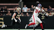 Oct 5, 2025; New Orleans, Louisiana, USA; New York Giants tight end Theo Johnson (84) catches a pass against New Orleans Saints linebacker Pete Werner (20) at Caesars Superdome. Mandatory Credit: Matthew Hinton-Imagn Images