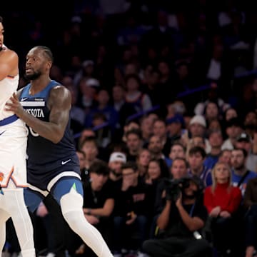Nov 5, 2025; New York, New York, USA; New York Knicks center Karl-Anthony Towns (32) controls the ball against Minnesota Timberwolves forward Julius Randle (30) during the second quarter at Madison Square Garden. Mandatory Credit: Brad Penner-Imagn Images