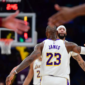 Apr 6, 2024; Los Angeles, California, USA; Los Angeles Lakers forward LeBron James (23) greets forward Anthony Davis (3) during the second half at Crypto.com Arena. Mandatory Credit: Gary A. Vasquez-USA TODAY Sports