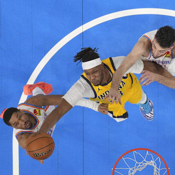 Myles Turner shoots against Aaron Wiggins (left) and Chet Holmgren (right) during the 2025 NBA Finals.