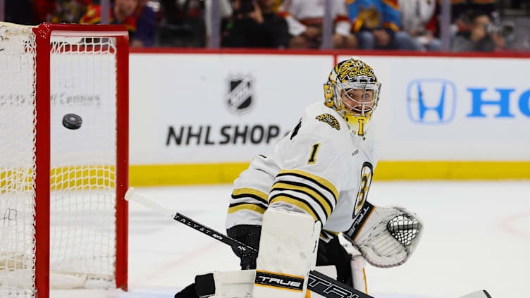 May 6, 2024; Sunrise, Florida, USA; Boston Bruins goaltender Jeremy Swayman (1) watches as the puck goes past the goal against the Florida Panthers during the second period in game one of the second round of the 2024 Stanley Cup Playoffs at Amerant Bank Arena. Mandatory Credit: Sam Navarro-Imagn Images