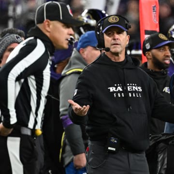Jan 28, 2024; Baltimore, Maryland, USA; Baltimore Ravens head coach John Harbaugh (center) questions a call against the Kansas City Chiefs during the second half in the AFC Championship football game at M&T Bank Stadium. Mandatory Credit: Tommy Gilligan-USA TODAY Sports