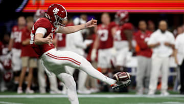 Dec 2, 2023; Atlanta, GA, USA; Alabama Crimson Tide punter James Burnip (86) punts against the Georgia Bulldogs in the first quarter  at Mercedes-Benz Stadium. Mandatory Credit: Brett Davis-Imagn Images