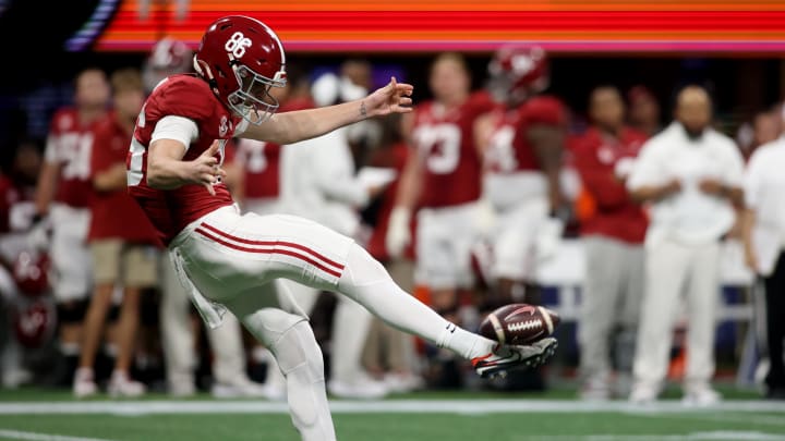 Dec 2, 2023; Atlanta, GA, USA; Alabama Crimson Tide punter James Burnip (86) punts against the Georgia Bulldogs in the first quarter  at Mercedes-Benz Stadium. Mandatory Credit: Brett Davis-USA TODAY Sports