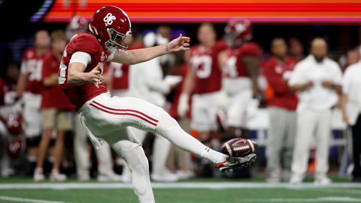 Dec 2, 2023; Atlanta, GA, USA; Alabama Crimson Tide punter James Burnip (86) punts against the Georgia Bulldogs in the first quarter  at Mercedes-Benz Stadium. Mandatory Credit: Brett Davis-USA TODAY Sports